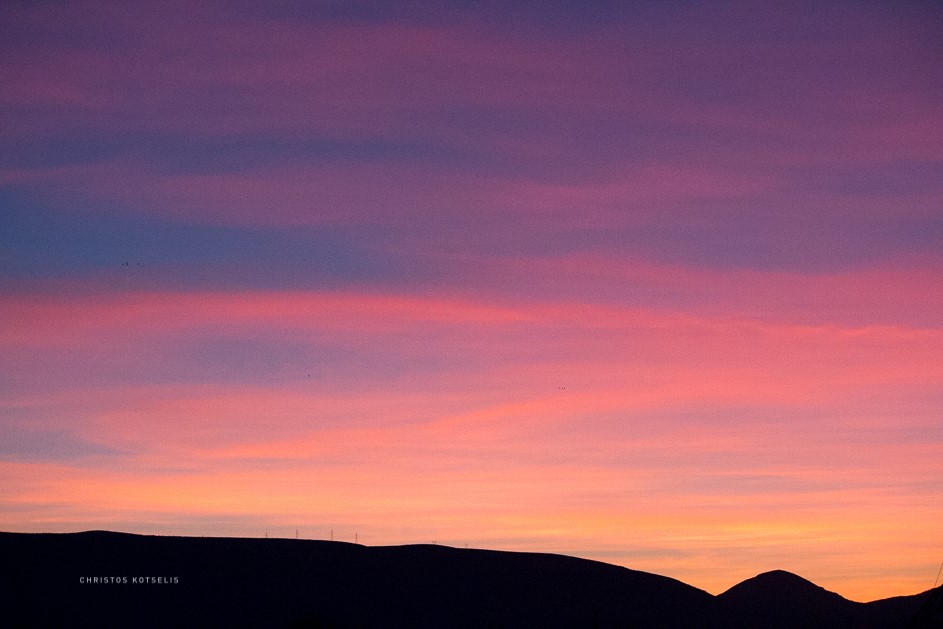 Purple colours over mountains sunrise during a birdwatching tour in Greece